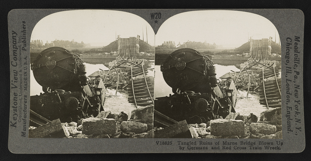 Tangled ruins of Marne Bridge blown up by Germans and Red Cross train wreck